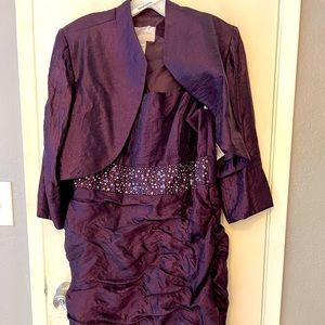 David’s Bridal Size 14 Gown.. in a beautiful shade of purple.Jacket is removable
